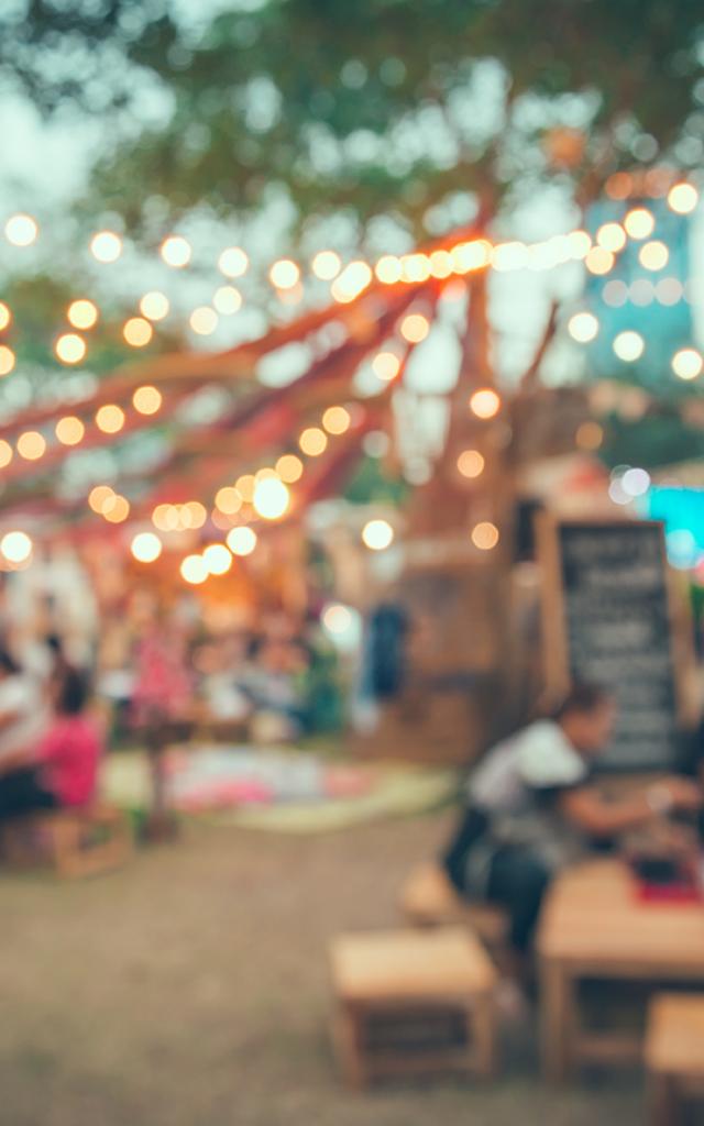 Abstract blur people in night festival city park bokeh background - vintage tone